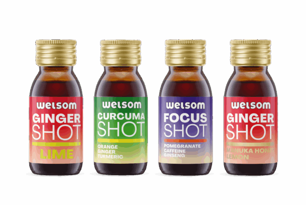 Four functional Welsom shots in glass bottles: Ginger Lime, Curcuma Orange Ginger Turmeric, Focus Pomegranate Caffeine Ginseng, Ginger Manuka Honey Lemon