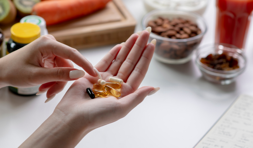 Dietary supplements in capsules and gels – daily support for health and energy surrounded by healthy food.