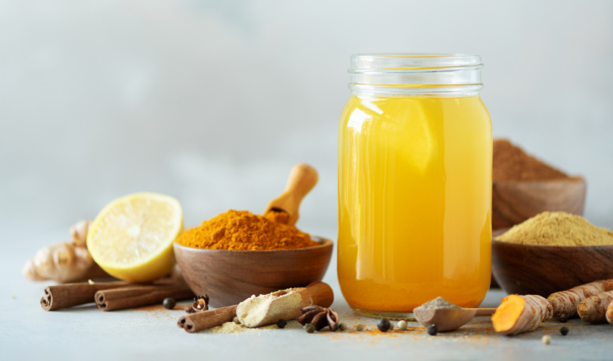 Natural ginger and turmeric health shot with lemon and spices for immune support
