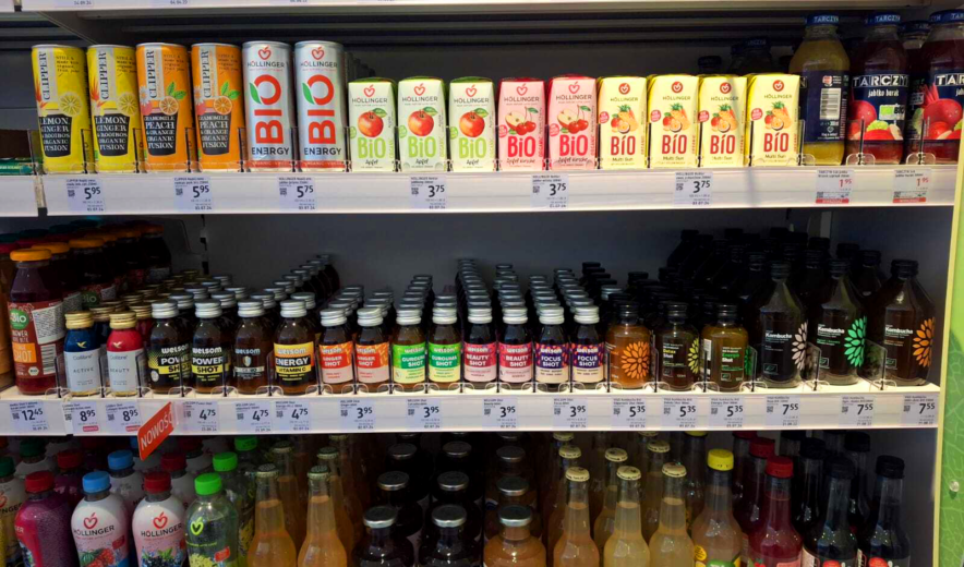 Functional and organic drinks on a retail shelf, including Chias Brothers shots among other brands