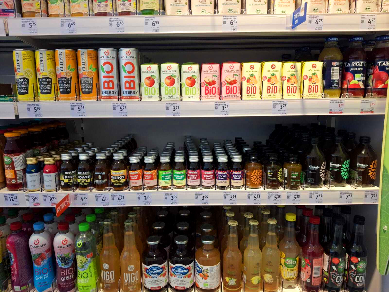 Functional and organic drinks on a retail shelf, including Chias Brothers shots among other brands
